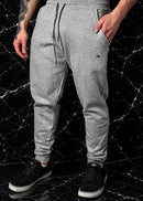 Calça moletom Tomy